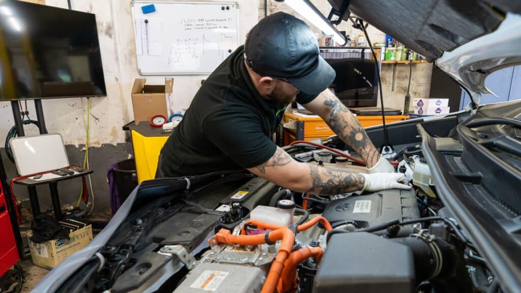 A Stedmans Garage technician inspecting a wheel on the ramp