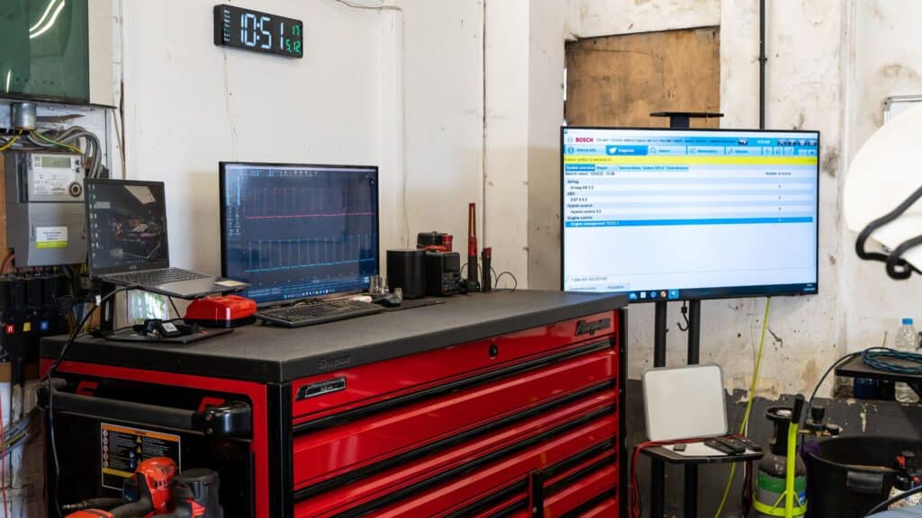 A technician running Range Rover-specific diagnostics at Stedmans Garage in Worthing