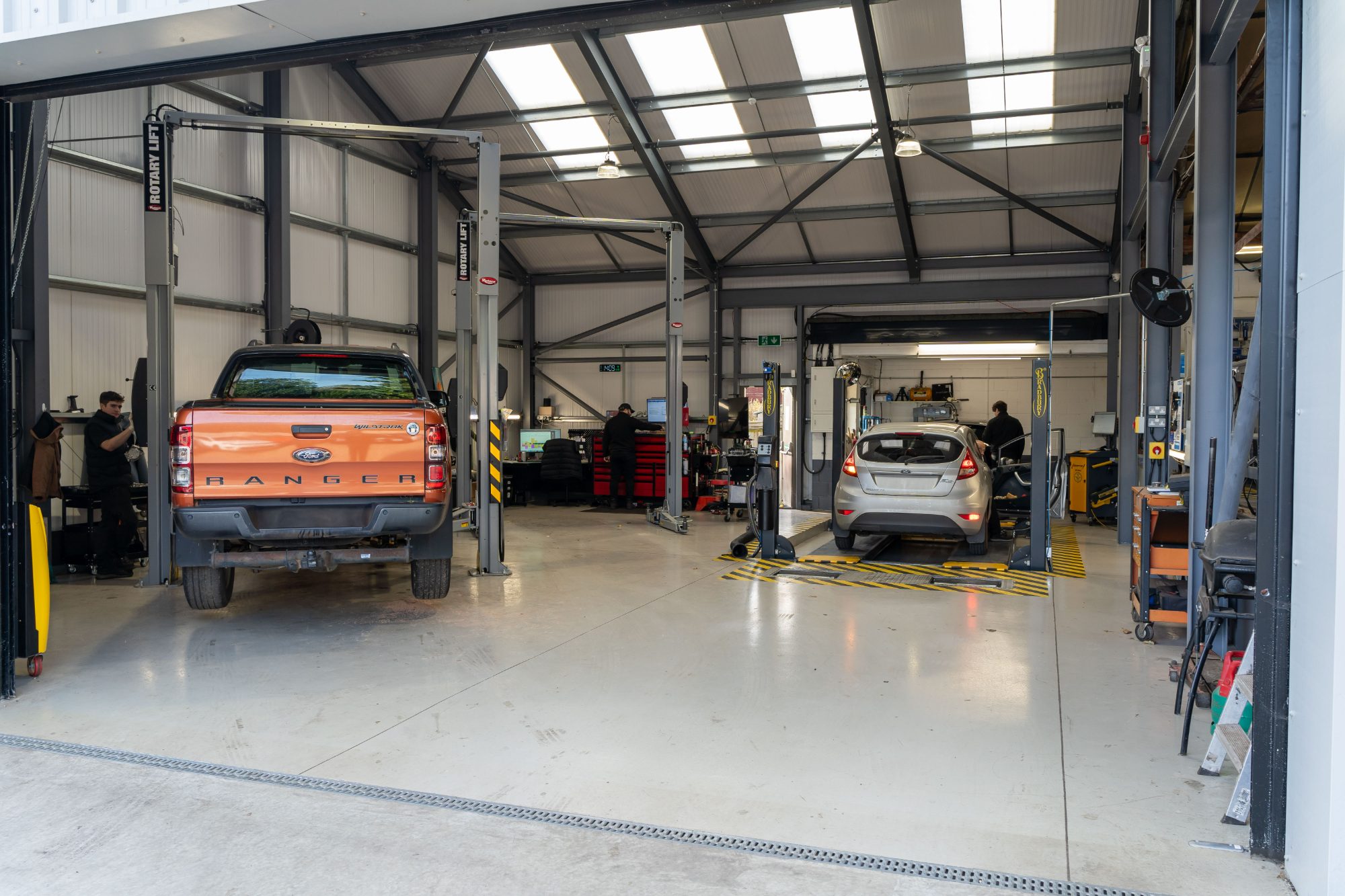 The Stedmans Garage workshop in Worthing, with cars up on the ramps